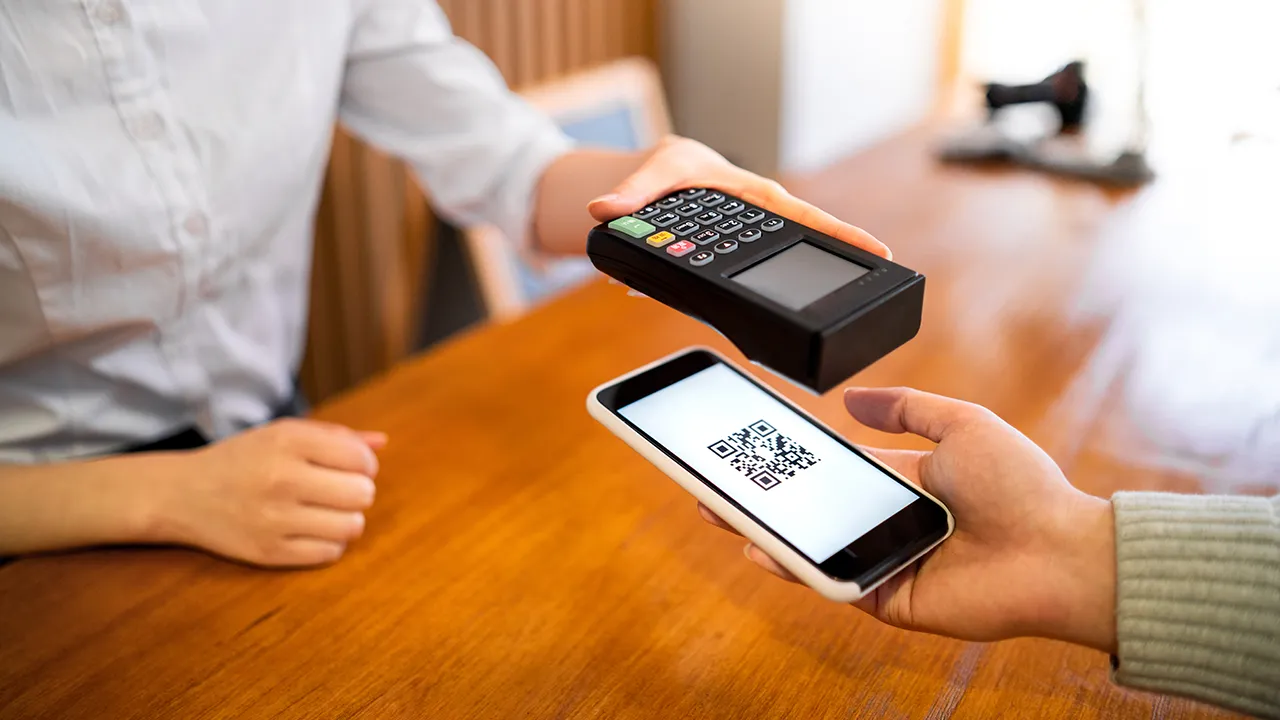 A customer paying at a retail checkout in Namibia